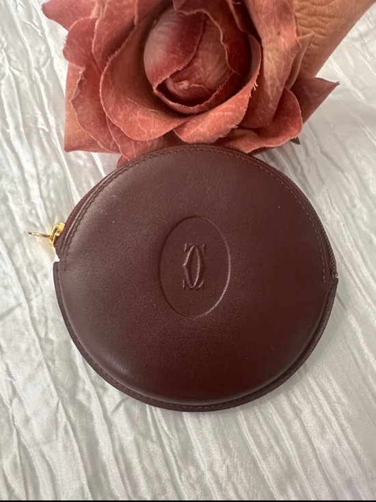 Cartier Accessories - Cartier Burgundy Leather Round Coin Pouch with Gold Zip Pull